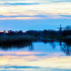 Kerk en Molen Woldzigt tijdens zonsondergang