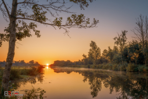 Zonsopkomst Nienoordsche polder richting Leekstermeer