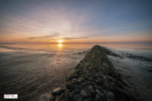 Strandhoofd tijdens zonsondergang Harlingen